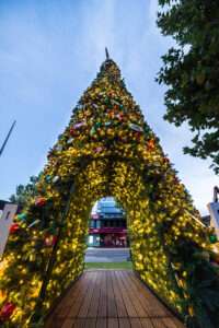 Outdoor 8m high walkthrough Christmas tree decorated in lights & baubles