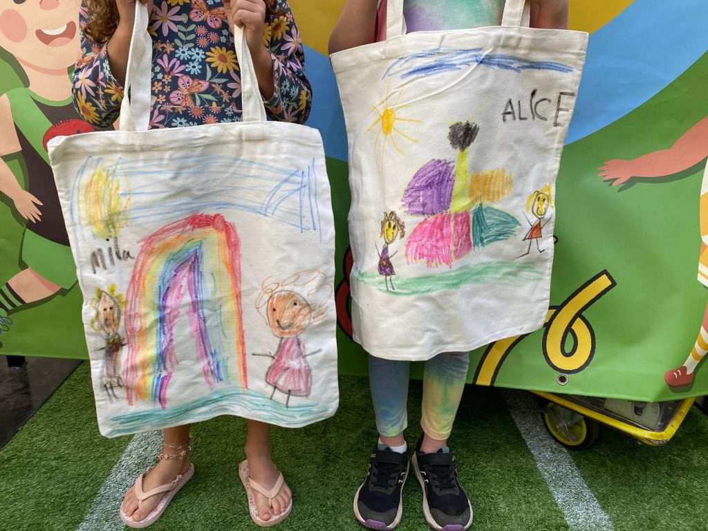 Two tote bags decorated by children