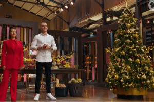 A 9ft Christmas tee decorated in gold, champagne and maroon, on the set of the TV show Dessert Master.