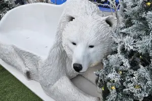 A white couch in the shape of a polar bear