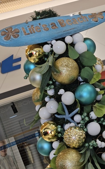 Beach themed Christmas tree with a Beach sign as the Christmas star.
