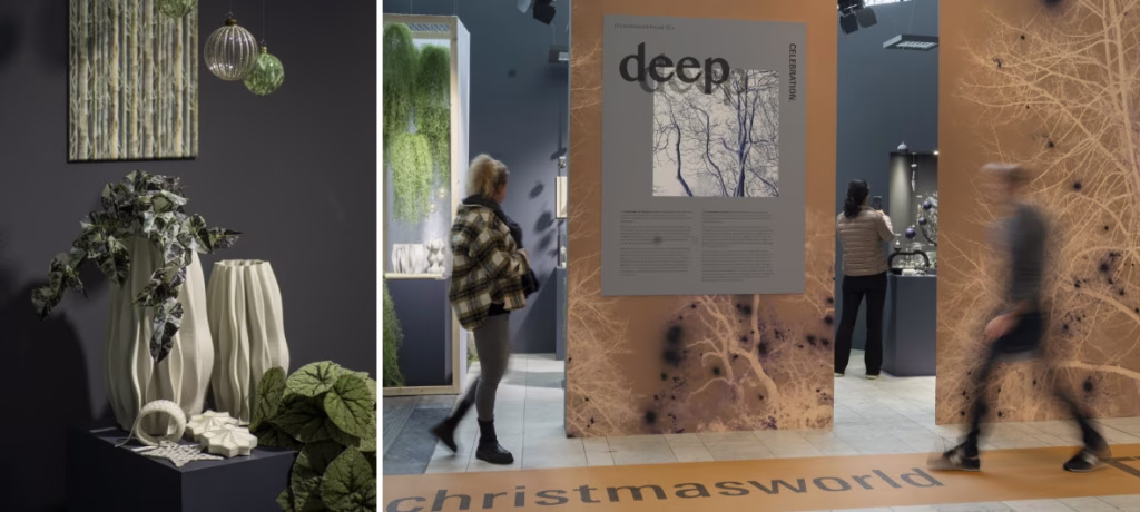 Modern interior design exhibition showcasing a sustainable sculptural vases with trailing plants and a moss wall art. Next to it are the passing visitors viewing the deep magazine display in contemporary gallery space.