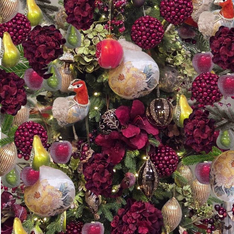 Christmas decorations including hydrangas, a partridge and a pear on a Christmas tree.