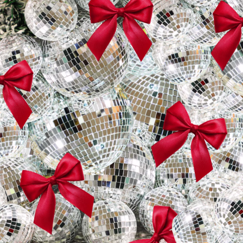 A mass of disco balls with red ribbon bows