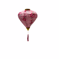 Lunar lantern balloon in pink fabric with floral patterns and a red tassel.