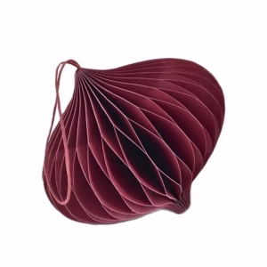 A honeycomb paper christmas onion decoration in red.