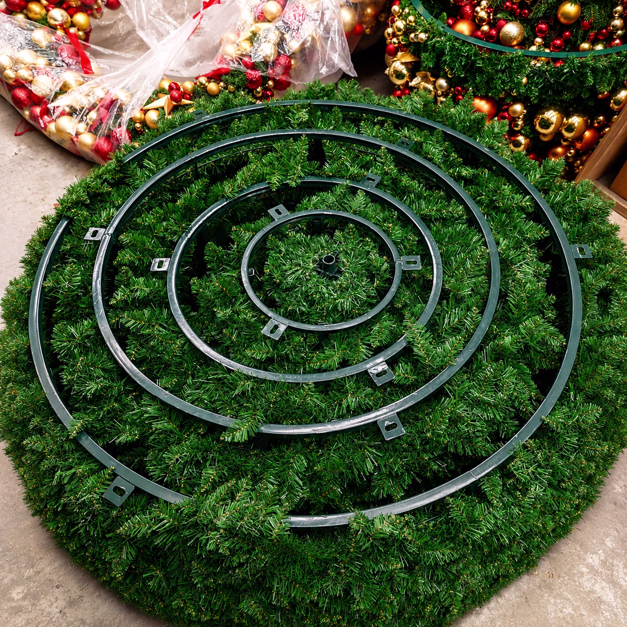 The frame of a green christmas tree stacked inside itself