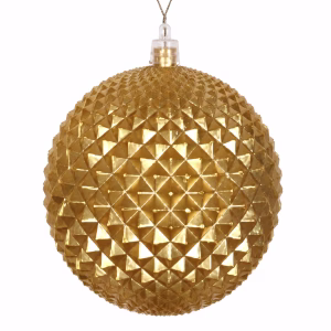 A gold Christmas bauble with pattern like a durian fruit.